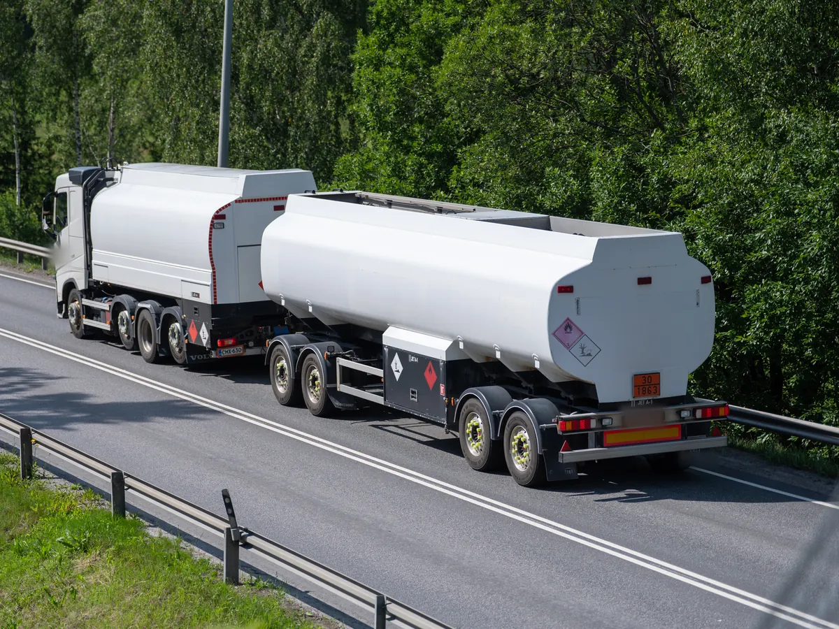 Tank truck with a drawbar tank trailer on a road in Finland, freight on the Nordic routes