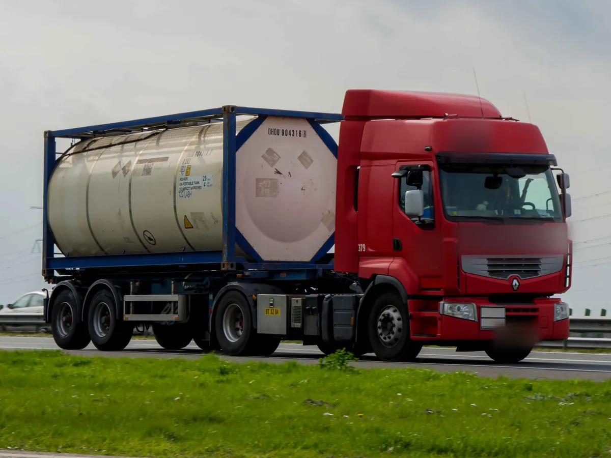 Tank container on a two axle container chassis on the A17 near Moerdijk